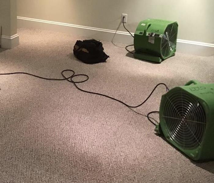 SERVPRO equipment in a living room on carpet