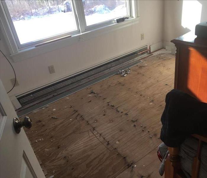 Damaged carpet removed from home's living room